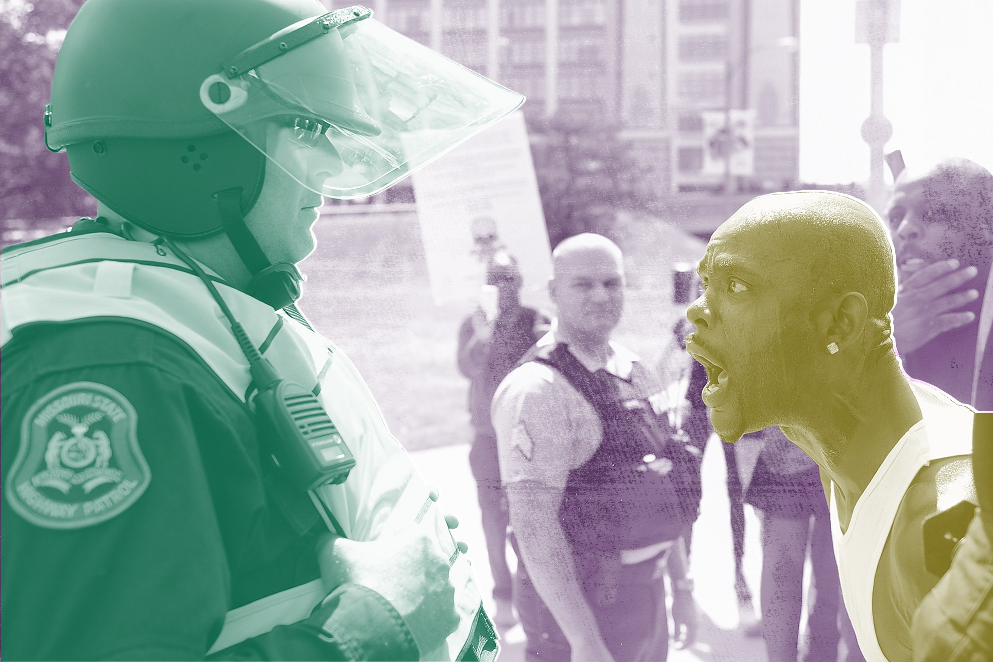 A man yells at a law enforcement officer during a protest action