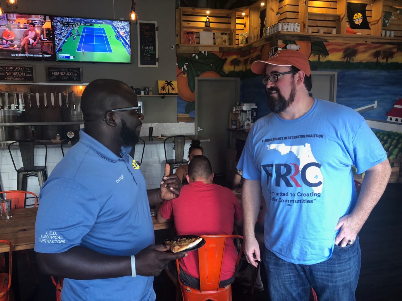 Neil Volz, political director of the FRRC, meets with a returning citizen working to help pass Amendment 4 in August 2018.
