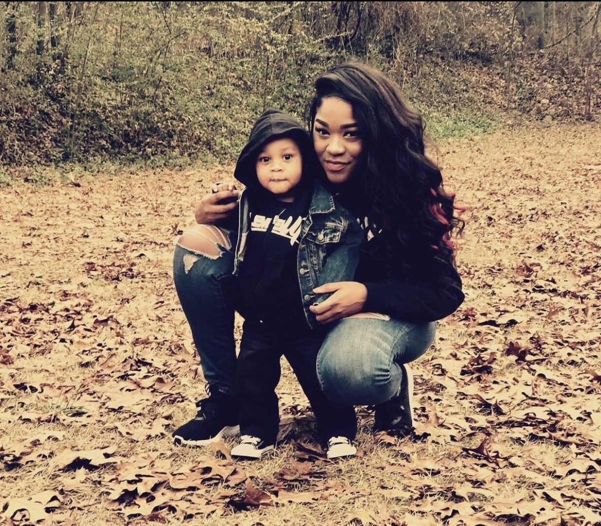 Photo of Nija Guider, one of the plaintiffs, with her son