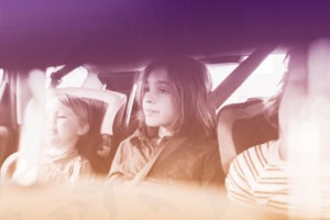Picture of three children in a car
