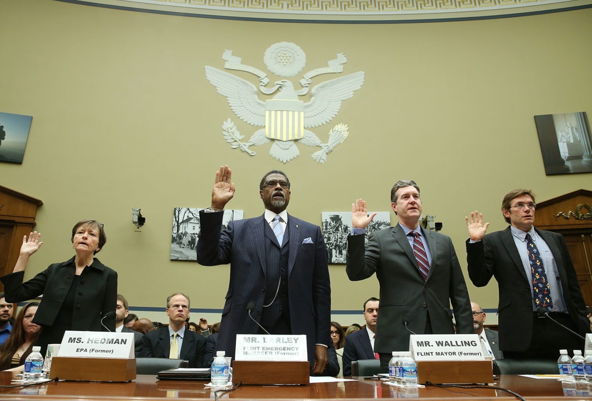 Image of officials being sworn in during House hearing on Flint water crisis