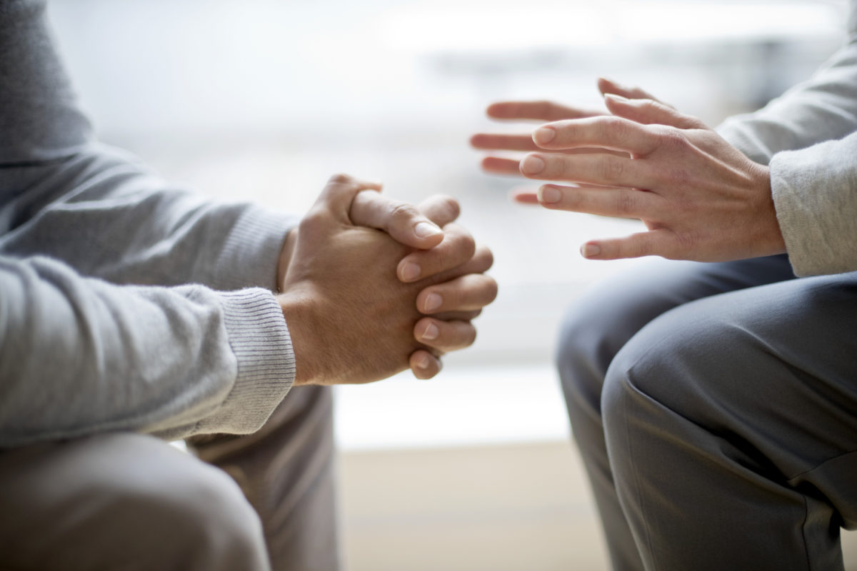 Two people sitting face to face