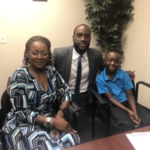 Cameishi Lindley with her son Bryce and their attorney Maurice Davis