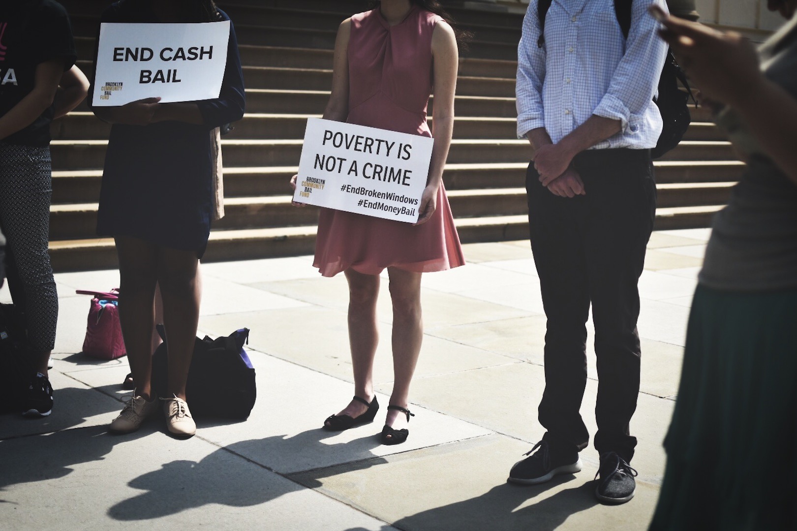 Photo of people holding signs