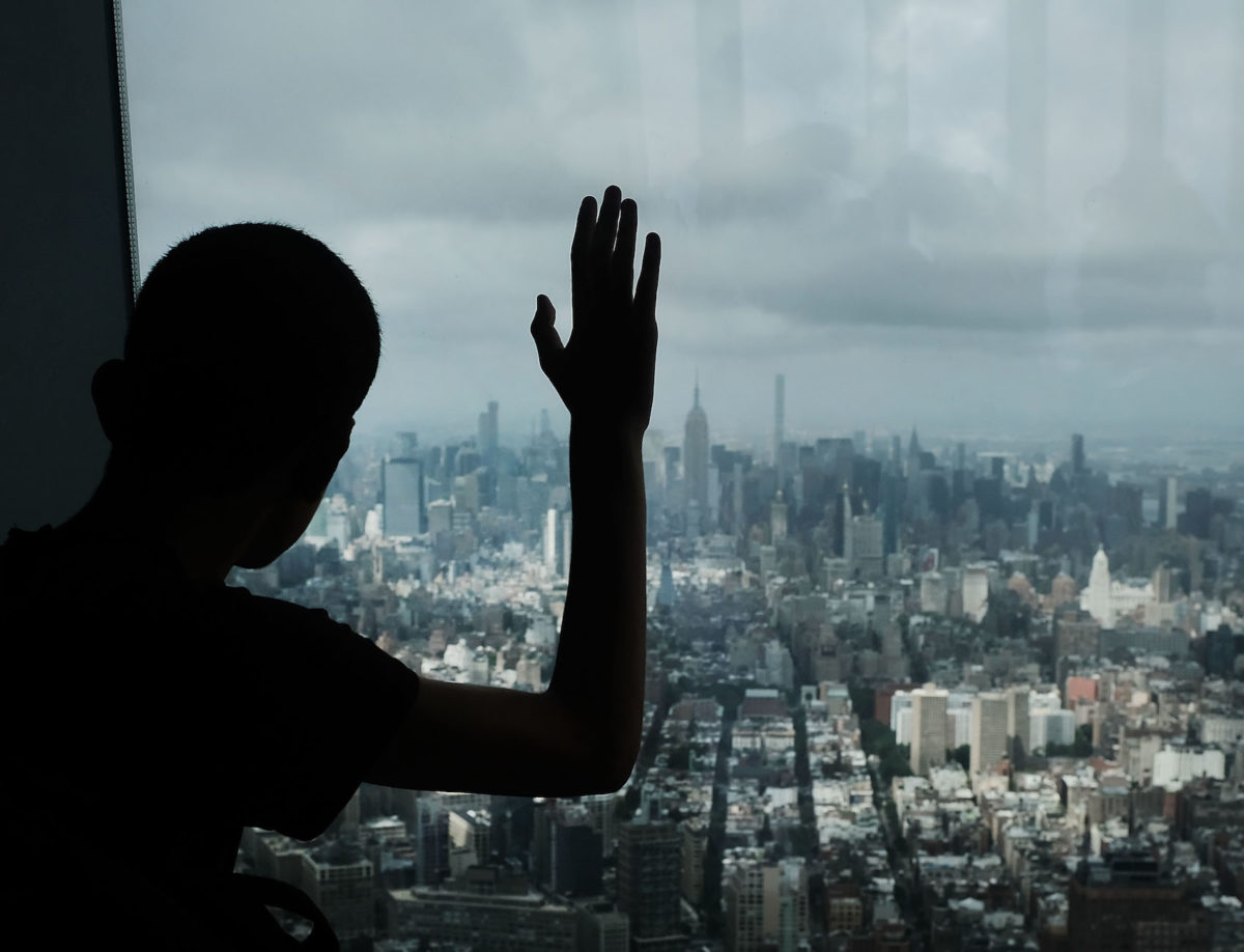 Teen looks out at Manhattan