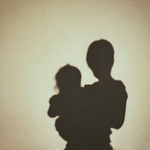 Shadow Of Mother And Daughter On Wall