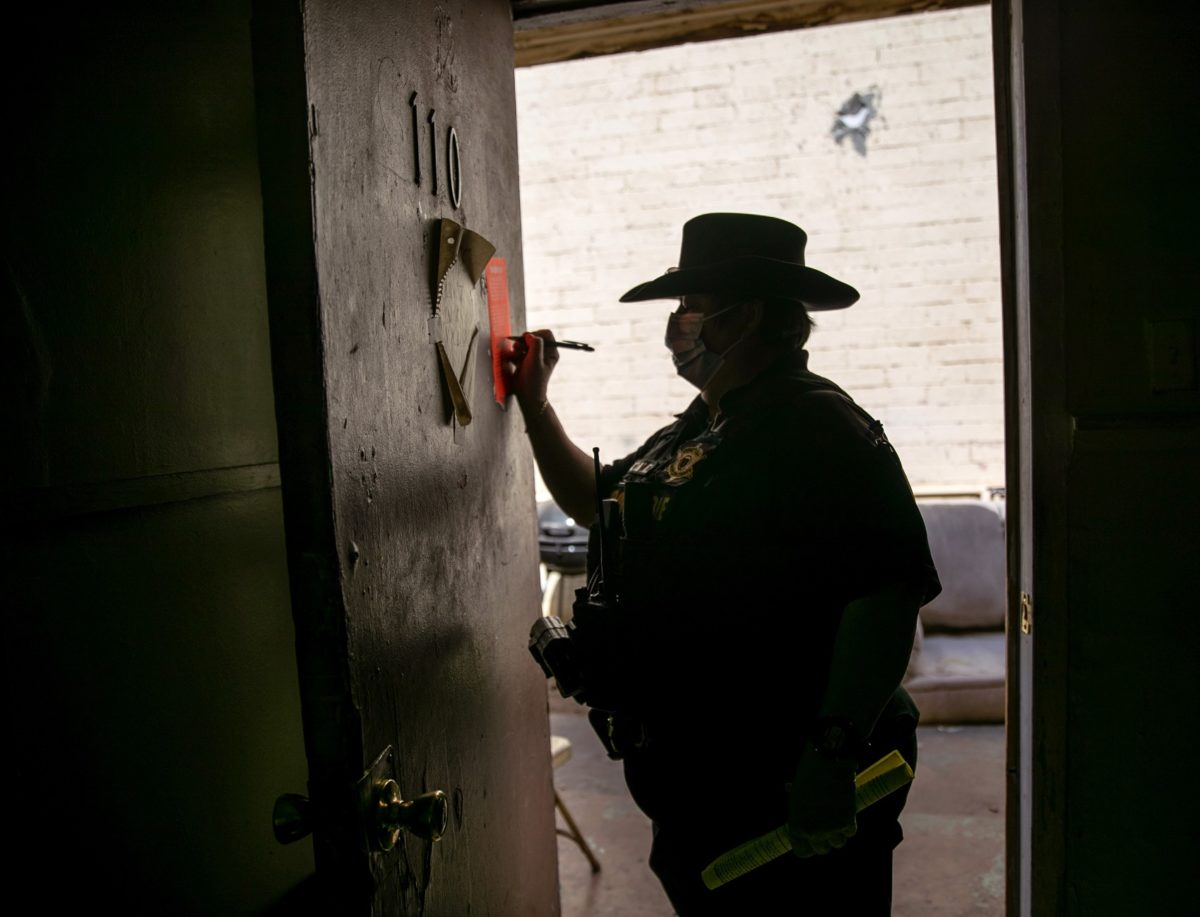 Maricopa County constable Darlene Martinez signs an eviction order