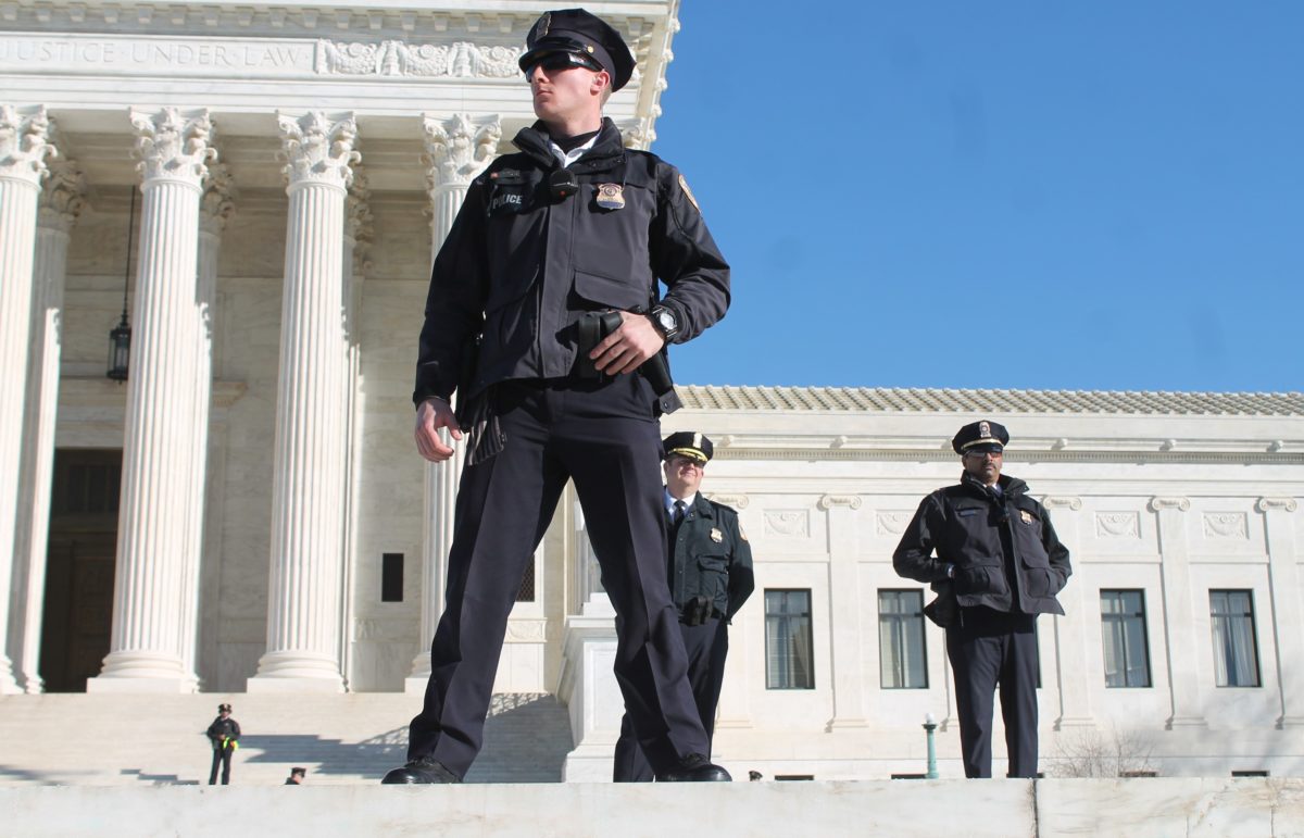 Police standing outside the Supreme Court.