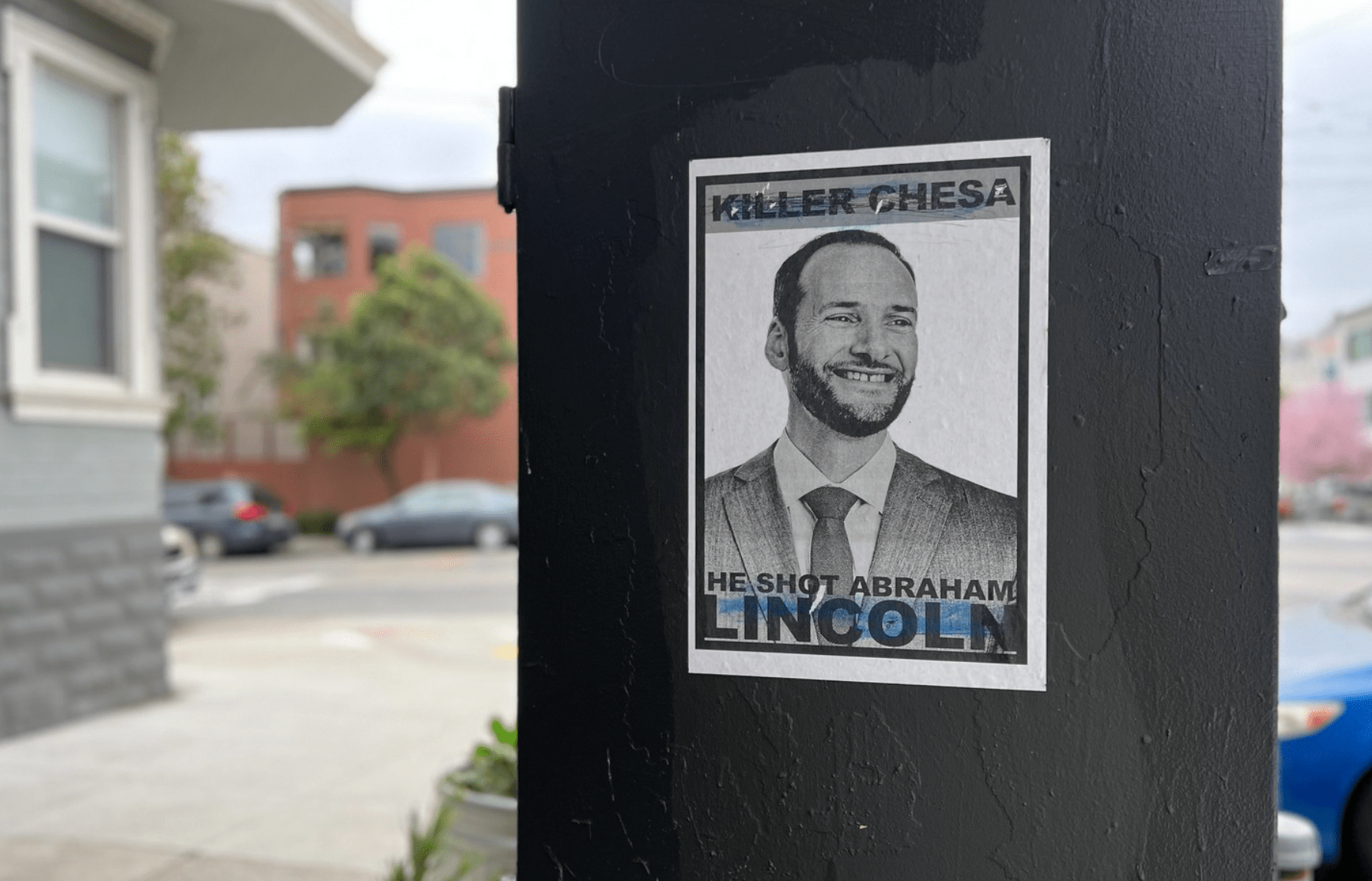 A street poster in San Francisco that reads "Killer Chesa, he shot Abraham Lincoln."