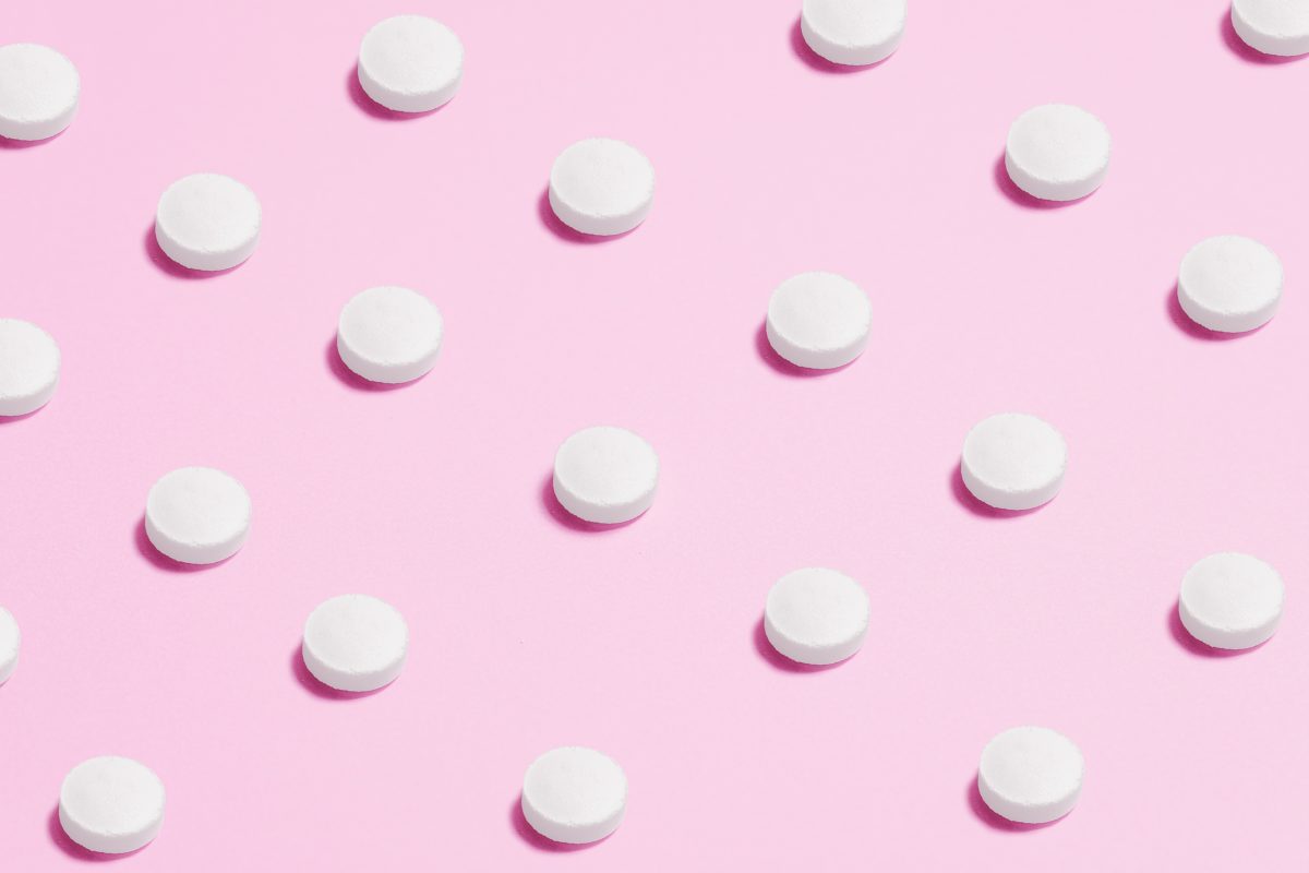 Pills on a pink background