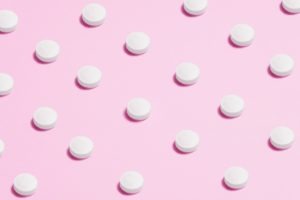 Pills on a pink background
