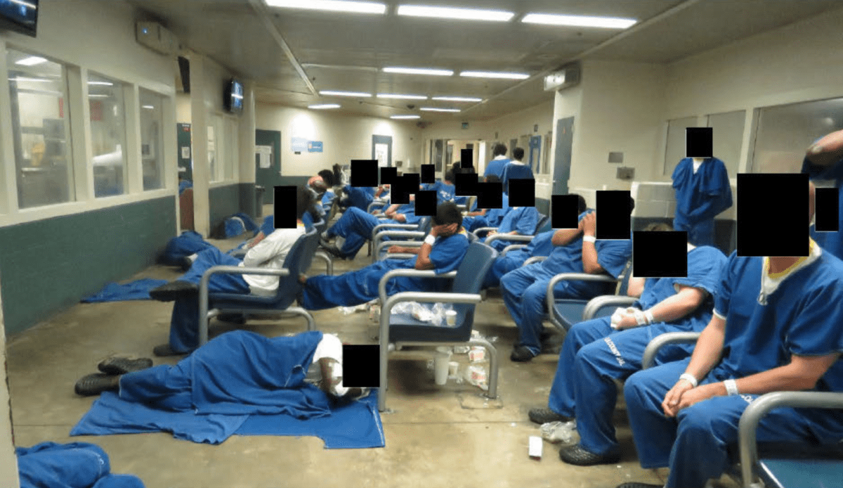 Detainees are packed into a room at Los Angeles County's Inmate Reception Center.