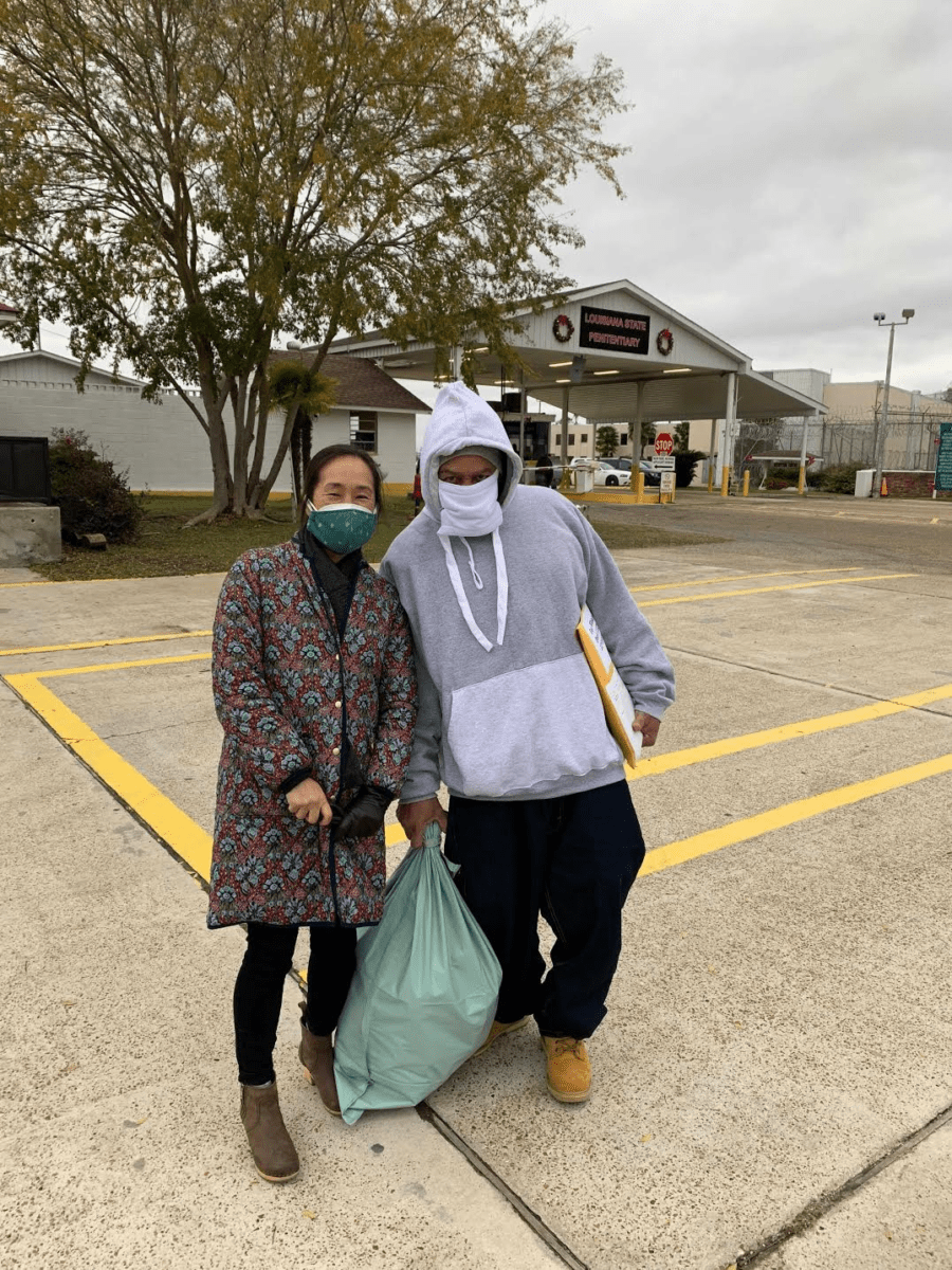 Fate Winslow and Jee Park, executive director of the Innocence Project New Orleans, stand outside Angola prison the day Winslow was released.