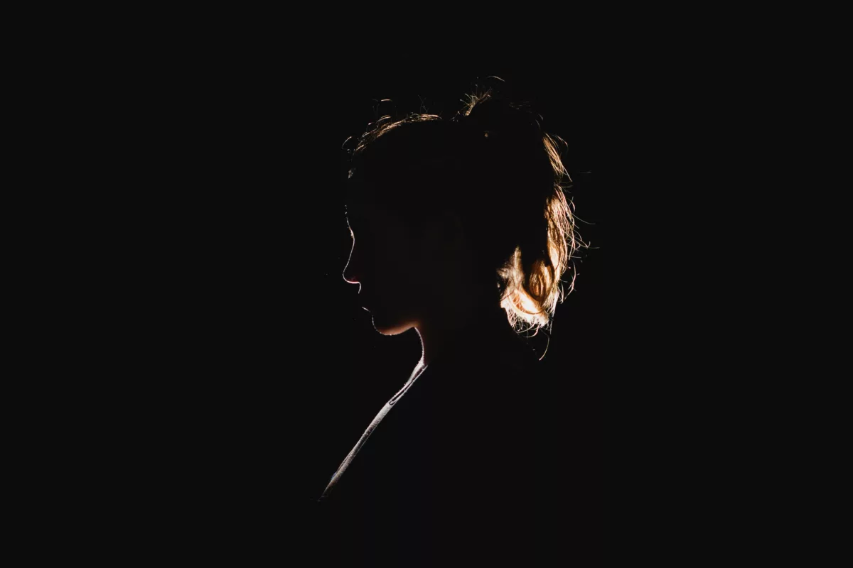 Silhouette of a woman against a black background