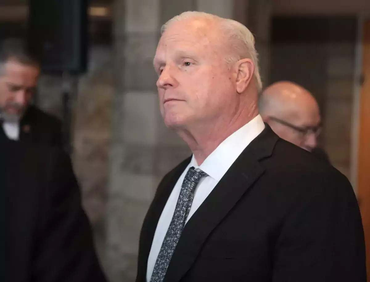 This photo is a close-up of Arizona Supreme Court Chief Justice Robert Brutinel. He is wearing a dark suit.