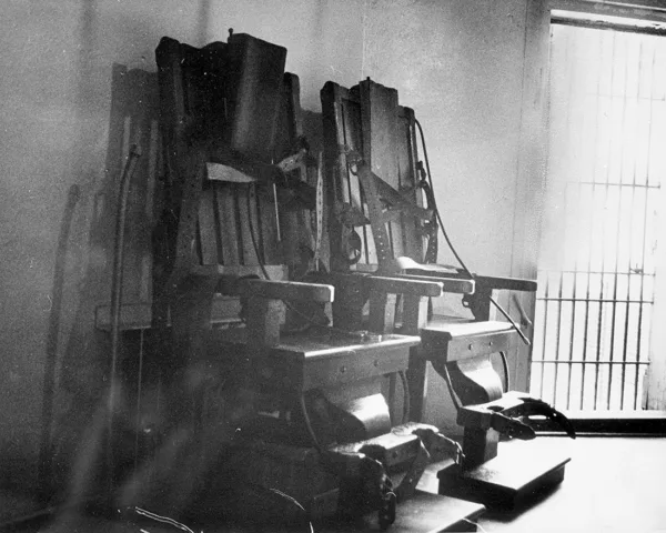 Two death chairs in old Central Prison, Raleigh, NC, death chamber, no date (possibly 1950-60s). Courtesy of Keith Acree. From the General Negative Collection, State Archives of North Carolina, Raleigh, NC.