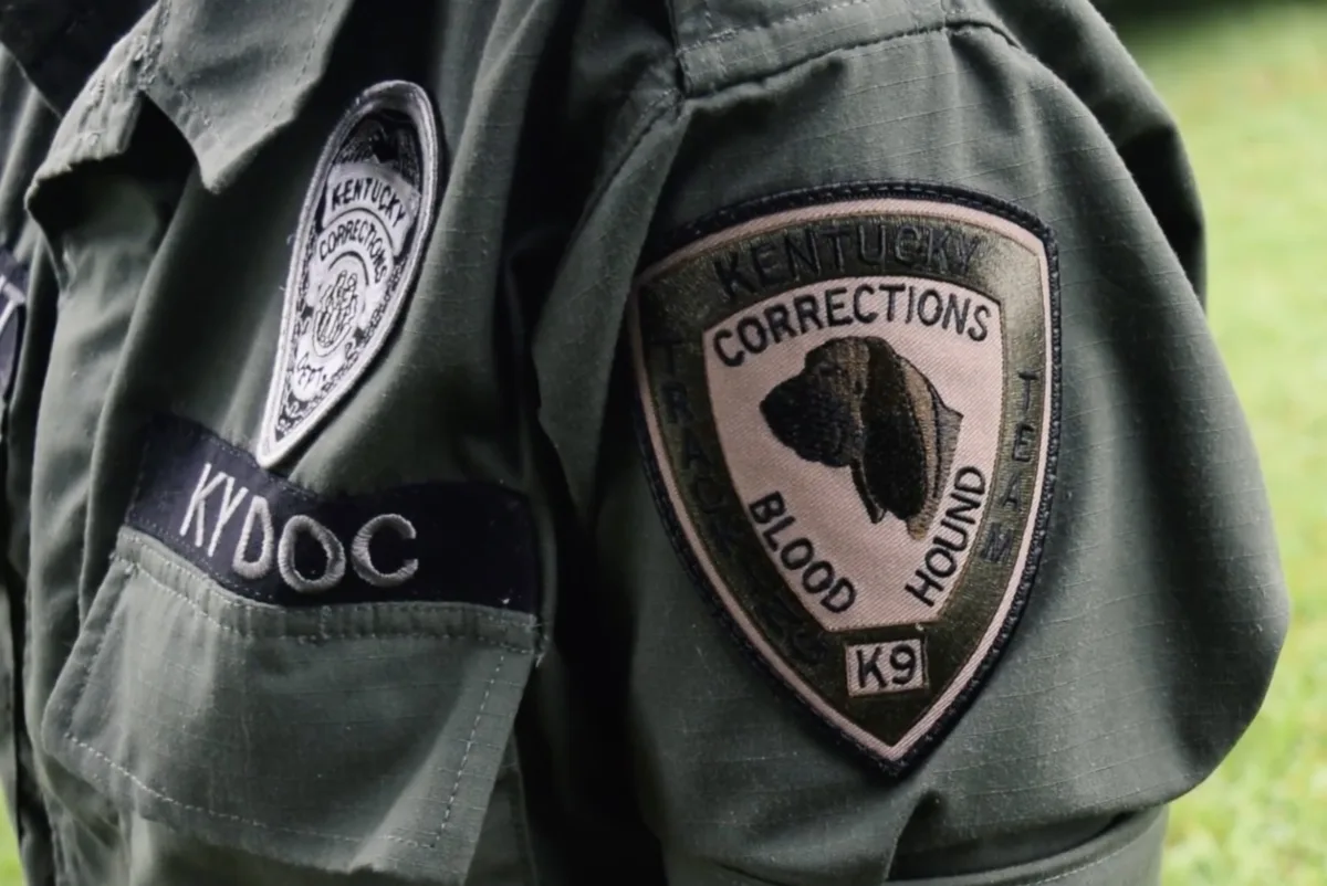This photo shows a close-up of the badge on a Kentucky Department of Corrections K9 officer.