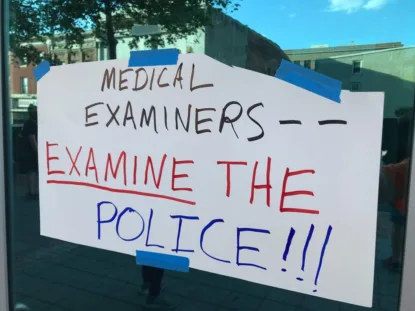 sign at a protest of Maryland's Office of the chief medical examiner