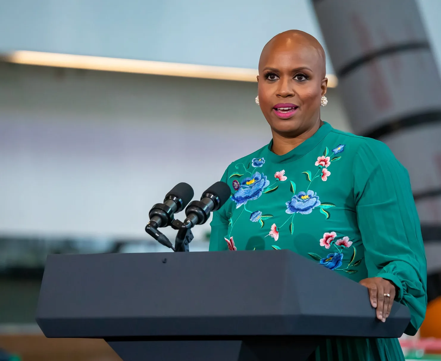 This photo shows U.S. Rep. Ayanna Pressley speaking at a lectern.