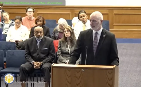 Virginia Prisons Director Chad Dotson speaks at a lectern at a state house hearing.