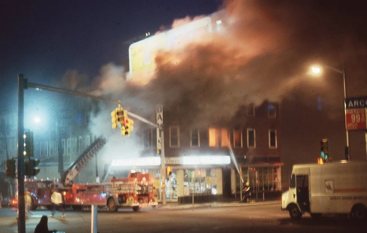 Firefighters battle the deadly Elliott Chambers Rooming House fire during the early morning hours of July 4, 1984.