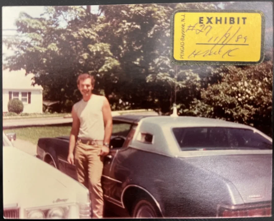 A young James Carver poses with his blue 1974 Mercury Cougar.