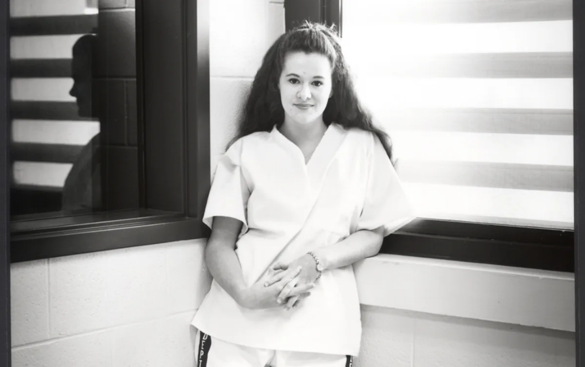 Christa Pike stands in prison in 1998.