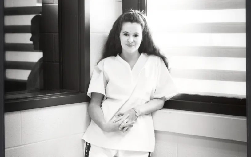 Christa Pike stands in prison in 1998.
