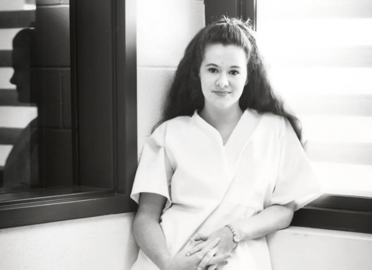 Christa Pike stands in prison in 1998.