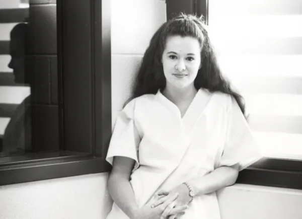 Christa Pike stands in prison in 1998.
