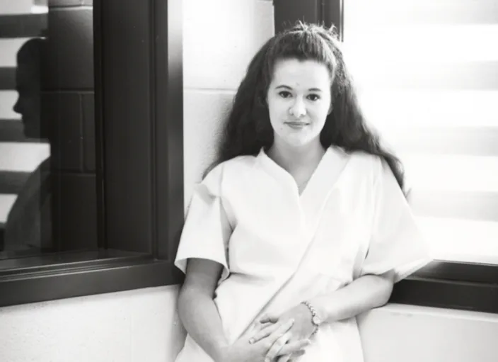 Christa Pike stands in prison in 1998.